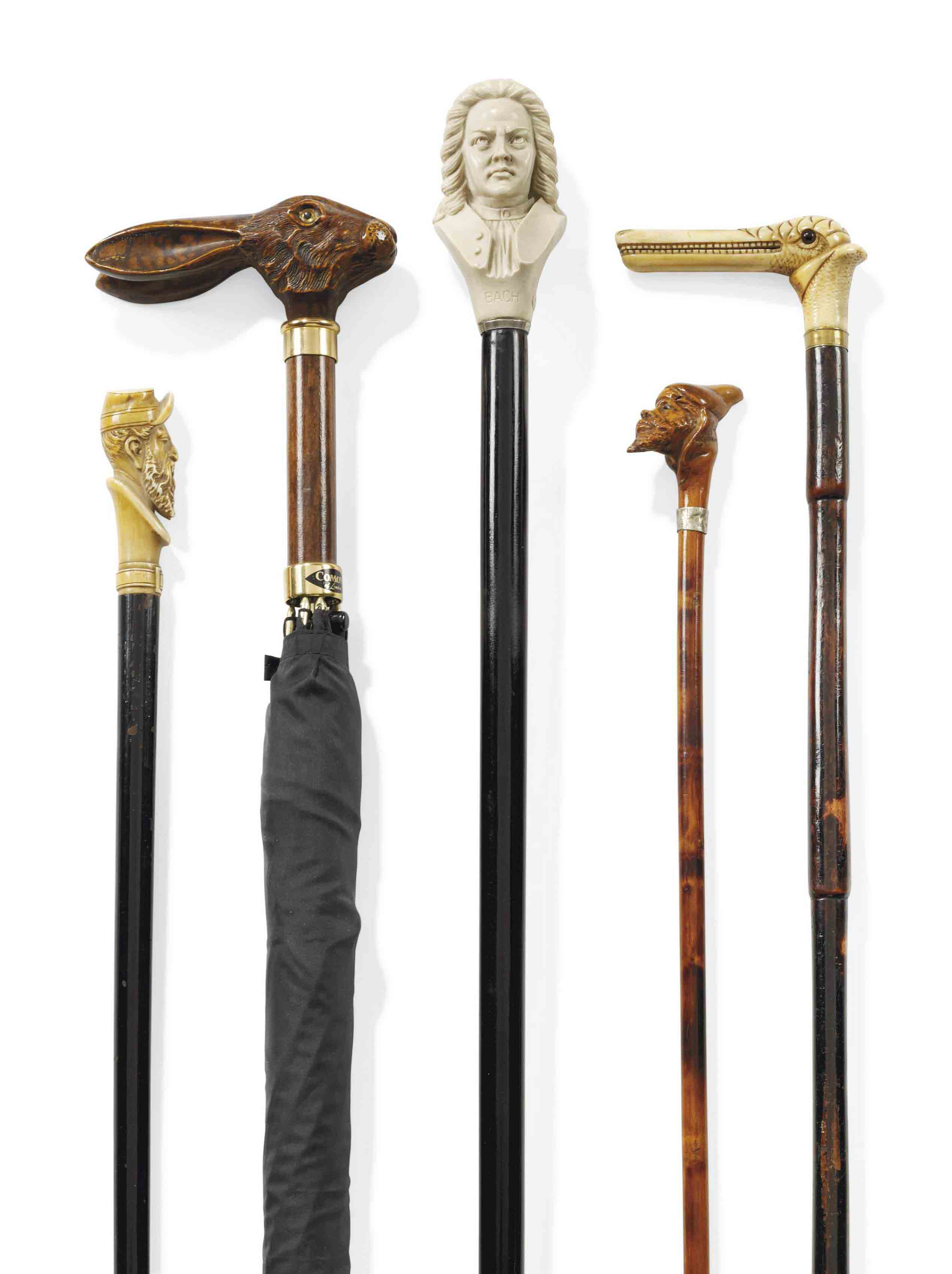 A GROUP OF TWELVE WALKING CANES INCLUDING A SPANISHCOLONIAL GILTMETAL